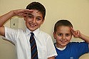 Brothers making victory salute their own