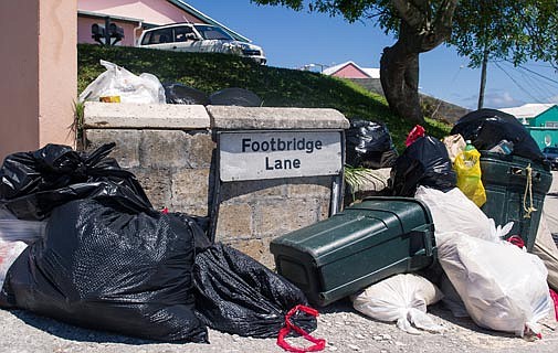 Unsightly piles of trash left to stew in the heat