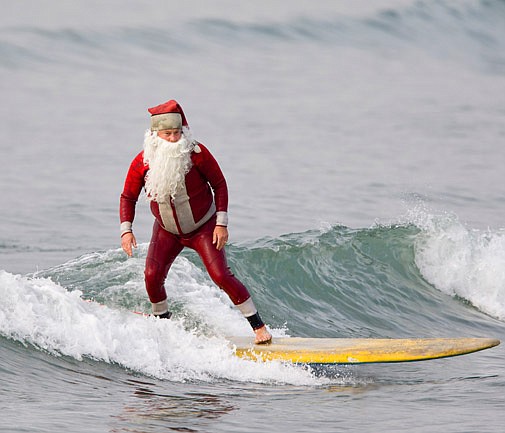 Santa surfs in, shouldering a sackful of sarcasm