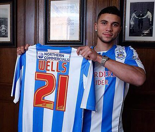 Wells signs for Terriers in club record deal