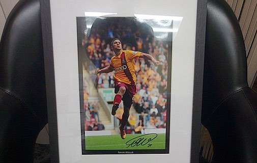 Win an autographed framed photo of Bermuda's soccer hero Nahki Wells!