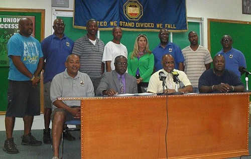 Dock workers agree to wage freeze