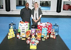 Martial arts group fights hardship with food gifts